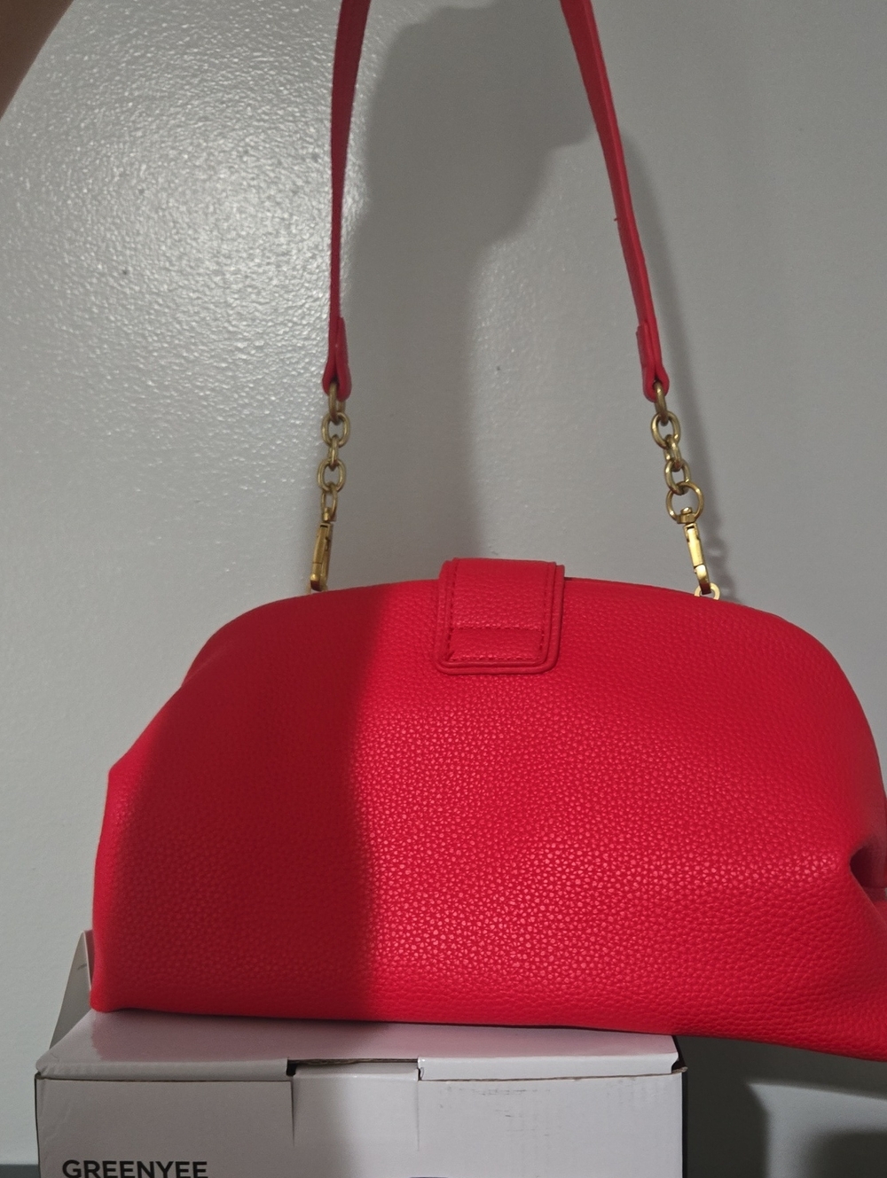 Elegant Red Pebbled Shoulder Bag with Gold Accents